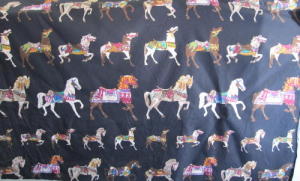 Fabric with dancing horses on black background